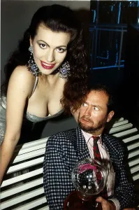 Kenny Everett comedian who died of aids with Cleo Rocos leaning over him dbase June