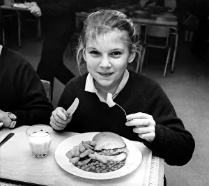 One Girl Only Prints: Kerry Dobison, 12, gets her dinner at Heaton Manor School
