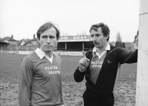 Kettering Town player manager Colin Clarke discussing tactics with captain Sean Suddards