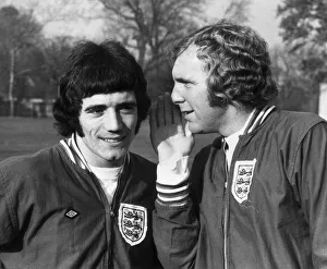 Kevin Keegan jokes with Englands captain Bobby Moore as the England squad train