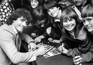 Autographs Prints: Kevin Keegan signing autographs at the opening of a furniture shop Circa 1983