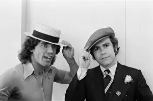 01069 Collection: Kevin Keegan in a straw boater hat and Elton John in his own hat