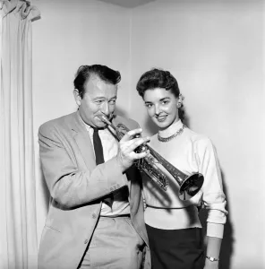 00064 Prints: Kim Pearson seen here with jazz trumpet player Humphrey Lyttleton. 1956 A518