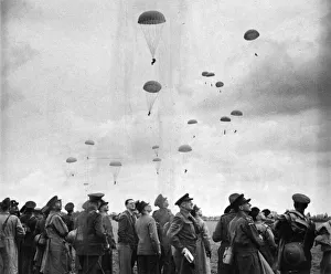 King George VI and Home Guard watch British Paratroopers during a demonstration