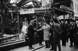 King George VI meets air raid wardens during his visit to the bomed damaged city of