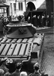 King George VI and Queen Elizabeth, pictured watching tank display whilst on their royal