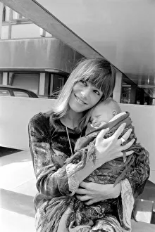 Young Couple Prints: Kings College Hospital on 18 August 1969 Anita Pallenberg holds rolling Stone Keith