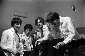 The Kinks pop group relaxing in their dressing room before a concert September1964