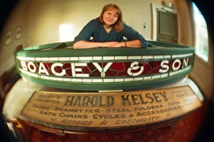 Displays Prints: Kirkleatham Old Hall Museum curator Leigh Lampard with two of the old shop signs