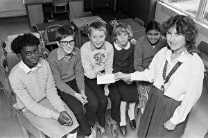 Money Prints: Kirklees junior chamber of commerce president Mrs Margaret Burnley presents a &pound