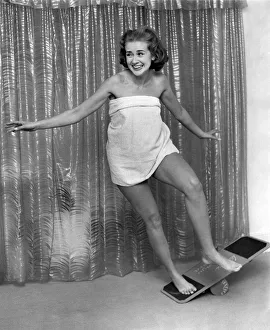 Health Prints: Knebworth Beauty Farm. Model Rosemary Stewart practising on the Bongo Board