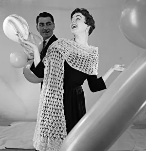 Knitted stole modelled by Jackie Jackson with Michael Bentley in background. July 1955