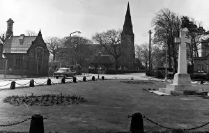 Knowsley Parish Church, with the green and war memorial in the foreground