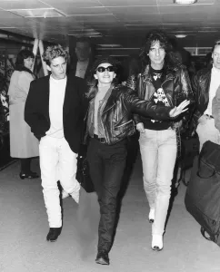 Kylie Minogue with Alice Cooper and Charlie Schlatter arrive at Heathrow Airport