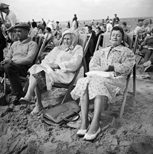 Two ladies from Hull come preapred for bad weather with their lastic macs during a day