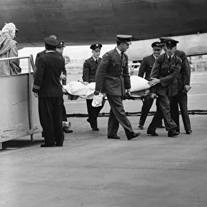 Illness Prints: Lady Churchill looks on from a fork lift truck at London Airport has her husband former