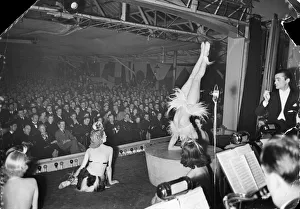 Show Prints: A lady does her acrobatic routine, entertaining the troops in one of the many organised