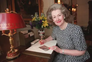 Lady Raine Spencer in Belgravia and at the Connought Hotel London in her bedroom writing