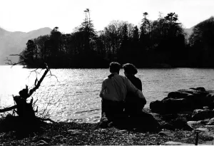 Lake District Prints: Lake District - Derwentwater - A courting couple sit on the lakeside 29 March 1965