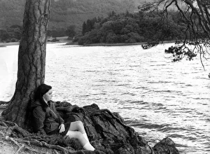 Lake District Prints: Lake District - Derwentwater - Friars Crag - A youngster sits by a tree
