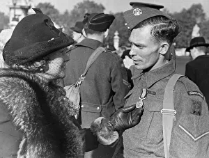 Decoration Prints: Lance Corporal Dean shows a friend his Military Medal for Bravery