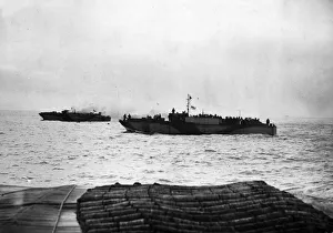 Holland Prints: A landing craft infantry going to the aid of LCI (S) 532 which was hit by enemy shells