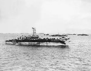 Landing craft prepare to land Allied troops on French beach. WW2 1944