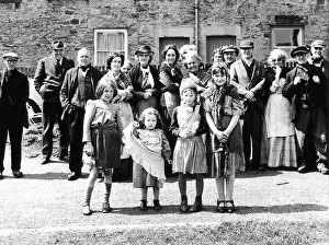 Shawl Prints: Langley Park villagers dressed up and waiting on set - their own street - ready to play