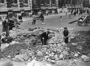 01441 Prints: A large bomb crater which narrowly missed two business offices during Thursday nights