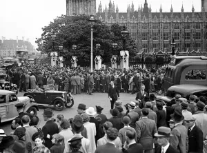 Declaration Of War Prints: Large crowds gather outside the Houses of Parliment for news following Germany