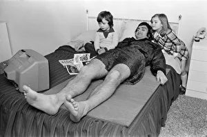 Larry Lloyd Coventry City football player lying on bed at home as he recuperates