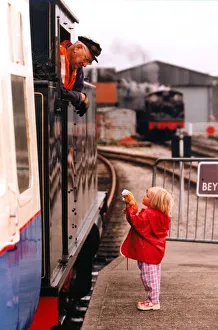 00339 Prints: Laura Milson, 3, of Whitley Bay, thanks the engine driver
