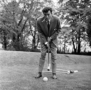 Laurence Harvey has a quick game of croquet on the lawn of the house in Priesthorpe Lane