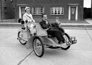 Laurence Mathew driving in his veteran car with his wife sitting in the front May