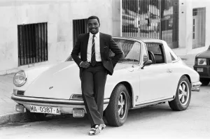 00433 Prints: Laurie Cunningham pictured with his Porsche car Mardid Spain. 24rh October 1982