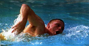 Lazio and England footballer Paul Gascoigne swimming in a pool in Rome as he battles to