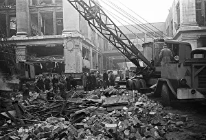 LCC and Civil Defence workers seen here clearing up following a V2 explosion at the Red