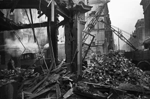 LCC and Civil Defence workers seen here clearing up following a V2 explosion at the Red