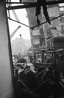LCC and Civil Defence workers seen here clearing up following a V2 explosion at the Red