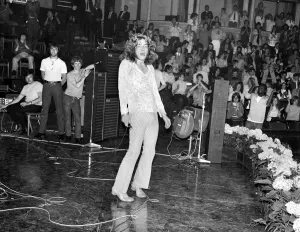 Albert Prints: Lead singer Robert Plant of Led Zeppelin rock group performing on stage during a concert