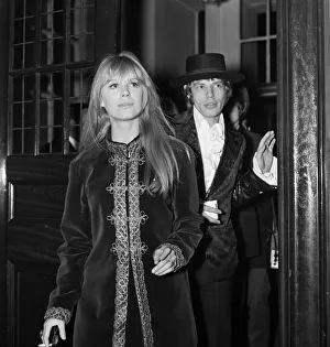 00882 Prints: Lead singer of The Rolling Stones pop group Mick Jagger with Marianne Faithful arriving