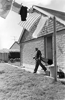 00059 Prints: Leader of the Labour Party Harold Wilson sets out for a game of golf from his cottage