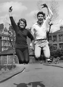 Leading Cliff A Dance! Girl leading Cliff Richard in a light-hearted