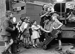01468 Prints: Leading Fireman Herbert Rogers is known to thousands of East London children as the Teddy