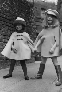 Holding Hands Prints: Lee Anne aged 3 wearing a Bolshoi Pink cape with fur trim with Sarah Barnett aged 4 seen