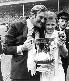 Leeds manager Don Revie with captain Billy Bremner hold the FA Cup trophy following their
