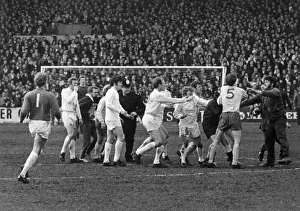 Leeds players surround referee Ray Tinkler after he awarded a controversial goal