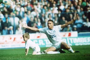 Leeds United footballer Vinnie Jones appeals after tackling the match mascot