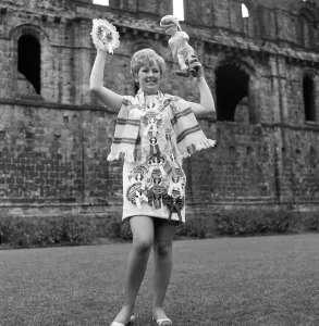 00331 Prints: Leeds United secretary Janet Rossidale with rosettes of all the teams beaten that season