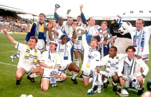Team Prints: Leeds United team celebrate with the league division one championship trophy